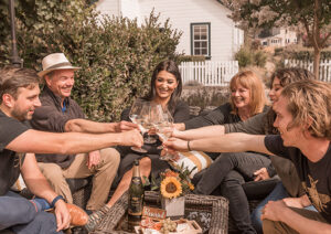 Meadowcroft team toasting with wine