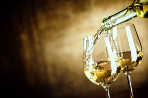 Pouring White wine into Glass 