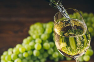 Pouring a white wine into the glass