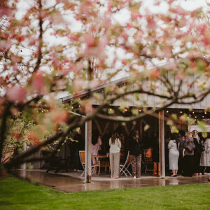 Outside view of private event space bordered by blossoming trees